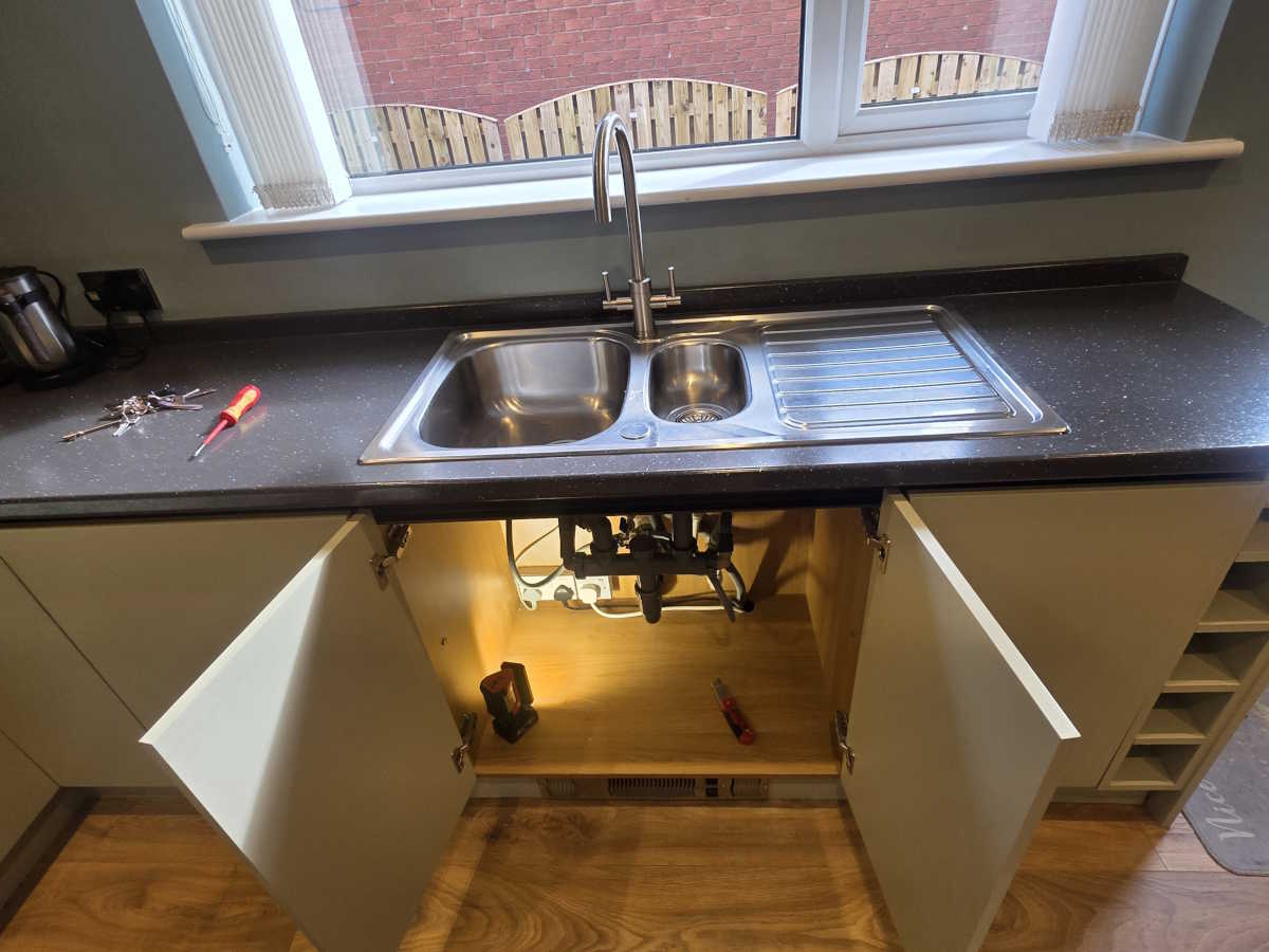 Kitchen plumbing pipework and fittings during installation in Carlisle.